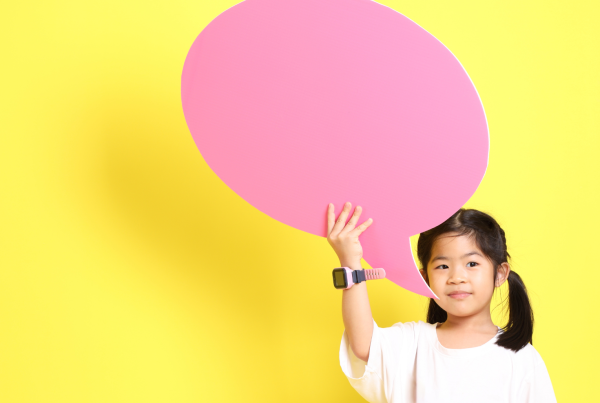 Child holding blog logo