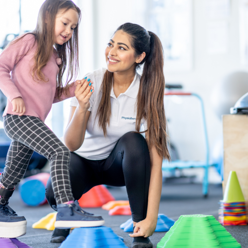 Child working with therapist on motor skills