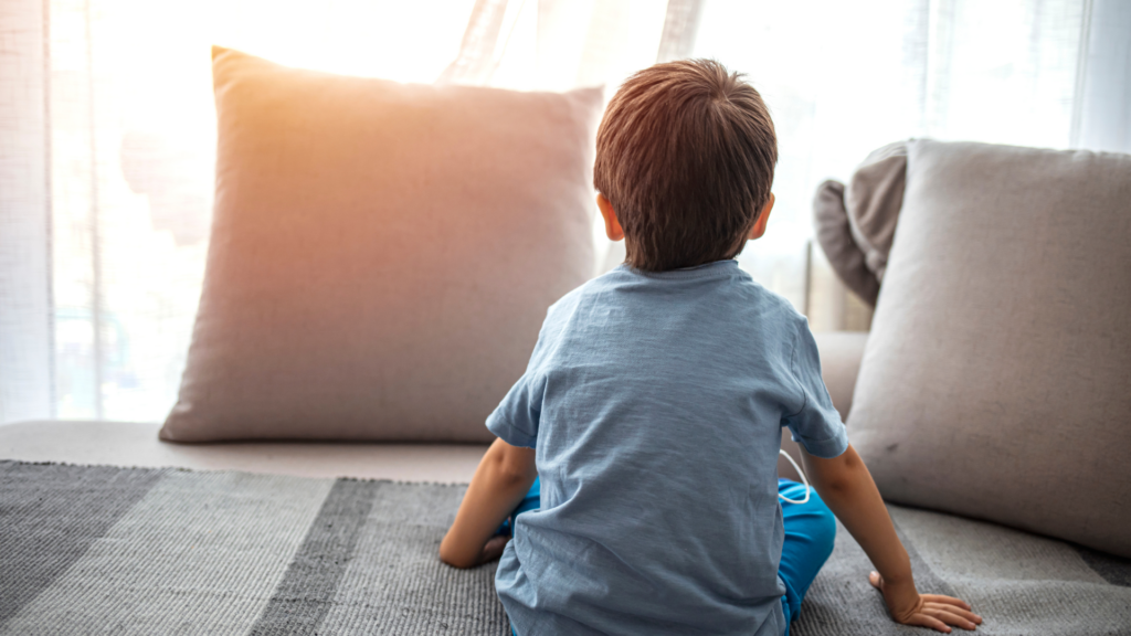 Child on the couch looking away