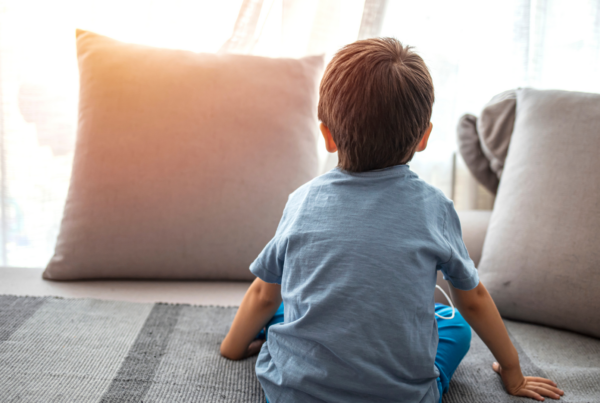 Child on the couch looking away