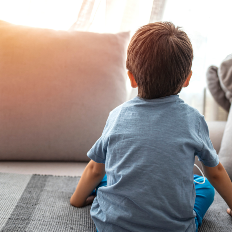 Child on the couch looking away