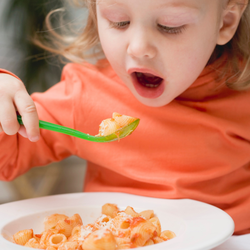 Picky Eater eating pasta at dinner